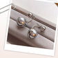 Boucles d'oreilles élégantes en perles grises