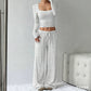 Ensemble haut ajusté en maille rayée et pantalon large