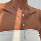 Colliers superposés avec croix dorées pour femme