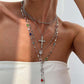Colliers superposés avec croix dorées pour femme