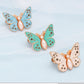 Bouton en forme de papillon qui s'adapte parfaitement
